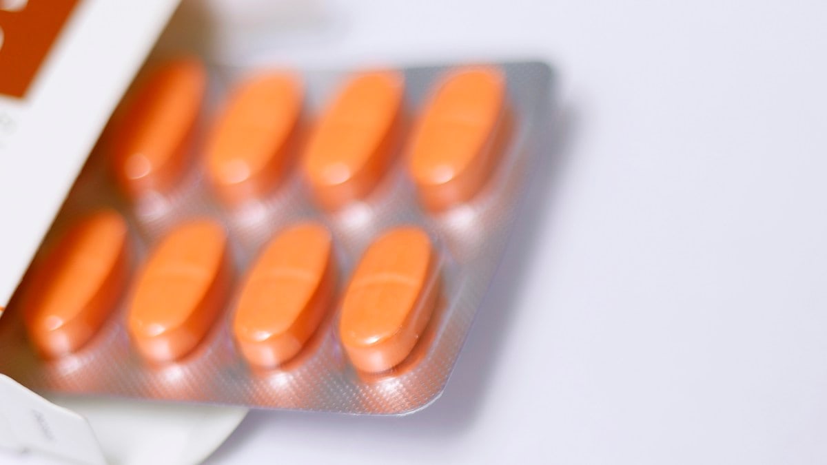 a pack of pills sitting on top of a white table